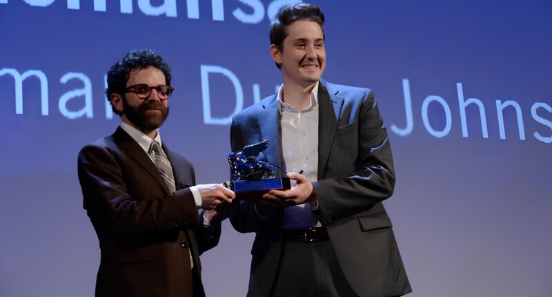 Award presentation at a film event.