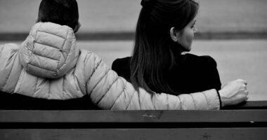 A couple on a bench.