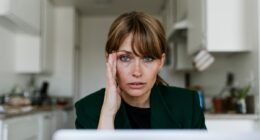 Stressed out woman working at home.