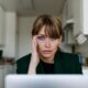 Stressed out woman working at home.